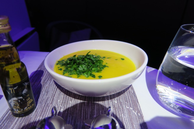 a bowl of soup with parsley on top