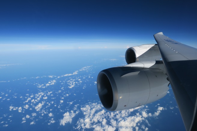 a plane flying above the clouds