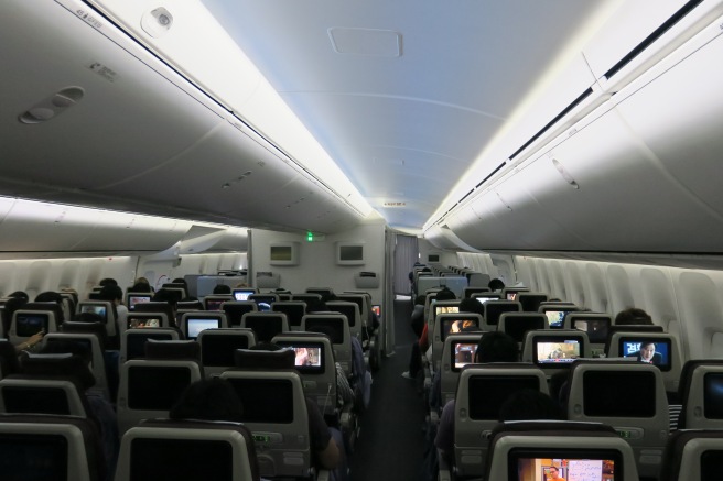 a group of people sitting in an airplane