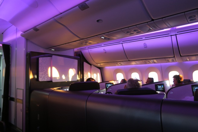 a group of people sitting in an airplane