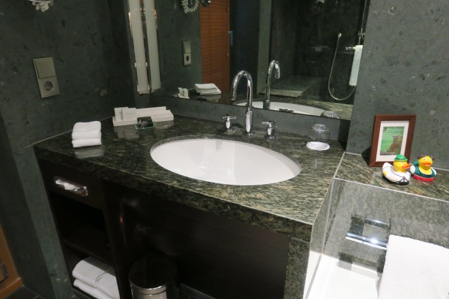 a bathroom with a sink and mirror