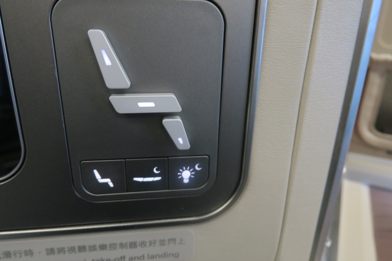 a seat buttons on a plane