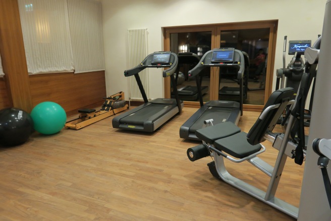 a room with treadmills and exercise equipment