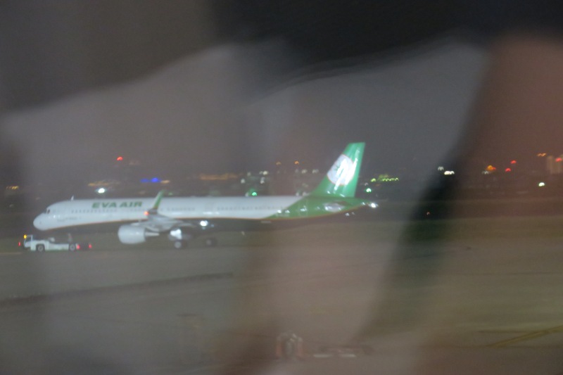 a plane on the runway at night