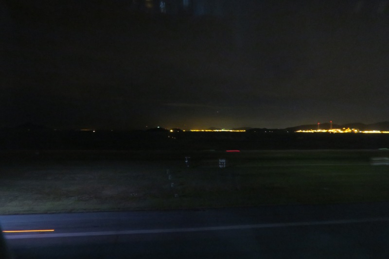 a view of a city at night from a window