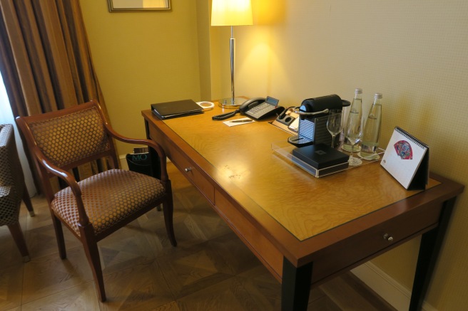 a desk with a phone and a telephone on it