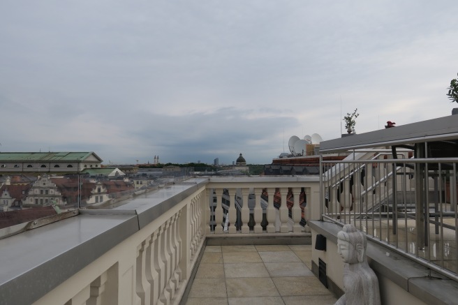 a balcony with a statue on it