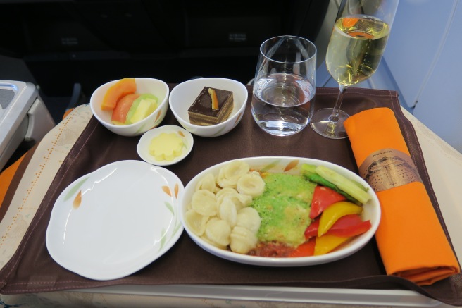 a tray with food and glasses on it