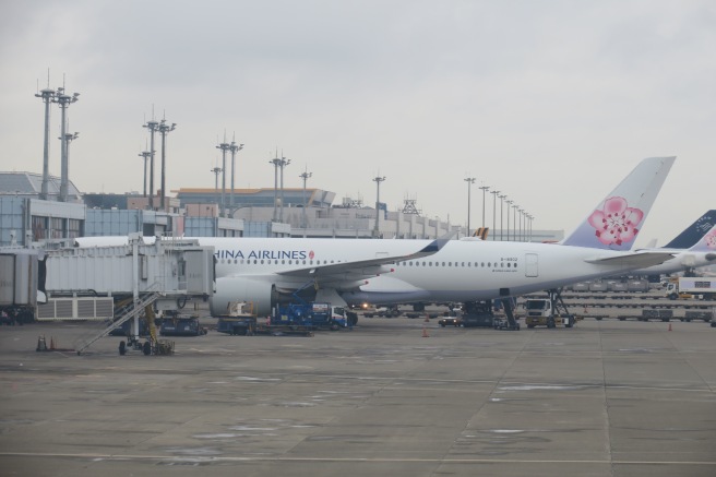 a group of airplanes at an airport