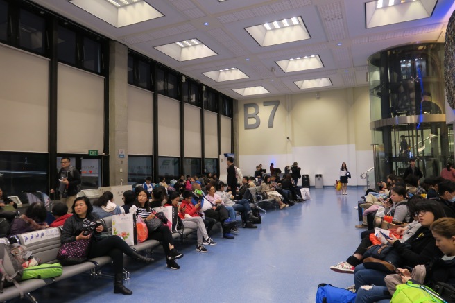 a group of people sitting in a waiting room