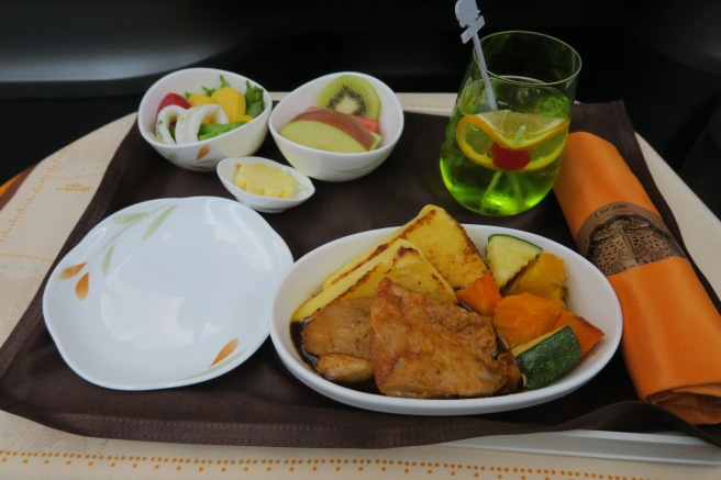 a plate of food on a tray