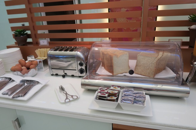 a bread in a glass case on a counter