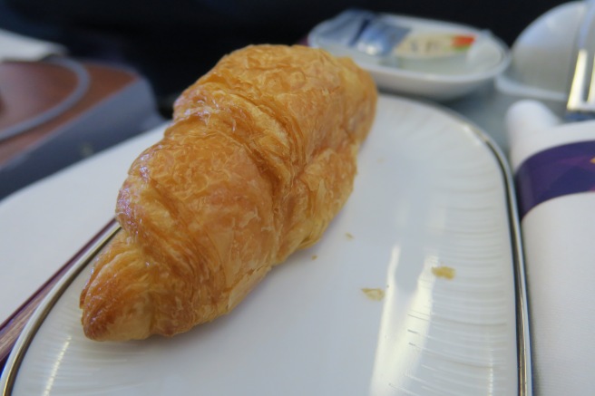 a croissant on a plate