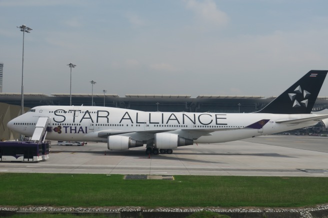 a large white airplane on a runway