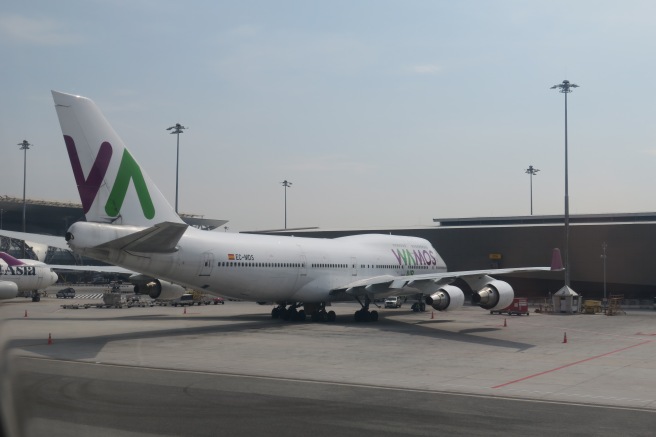 a large white airplane on a tarmac