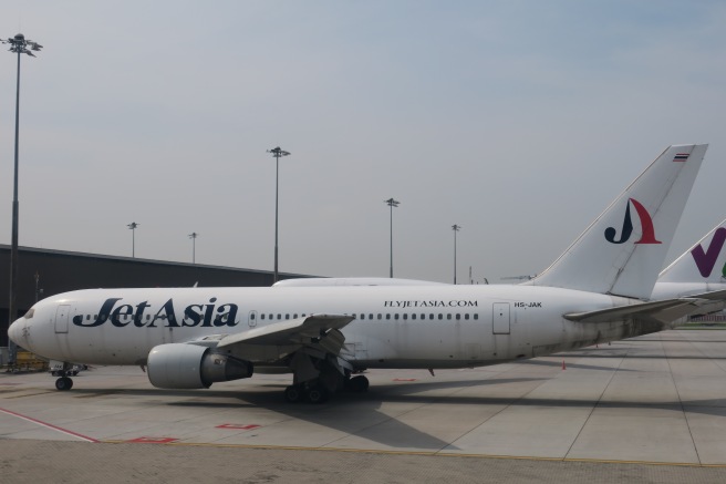 a white airplane on a runway