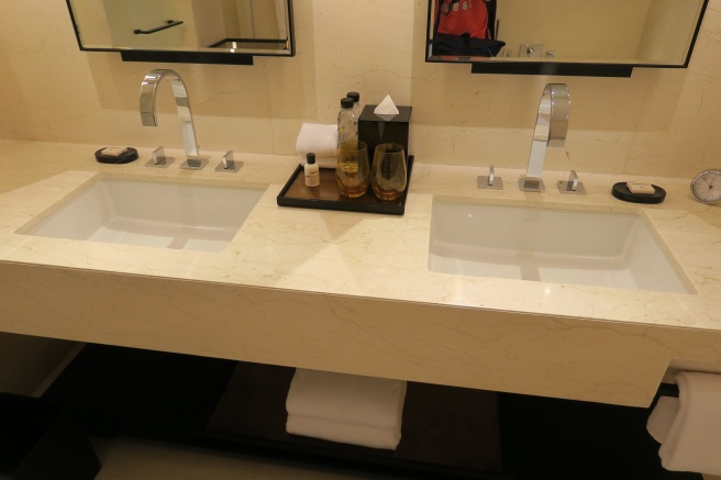 a bathroom with two sinks and mirrors