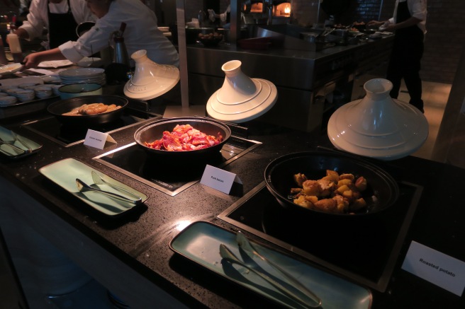 a group of bowls of food on a counter