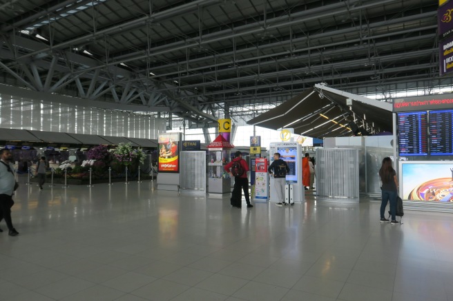 people standing in a large airport