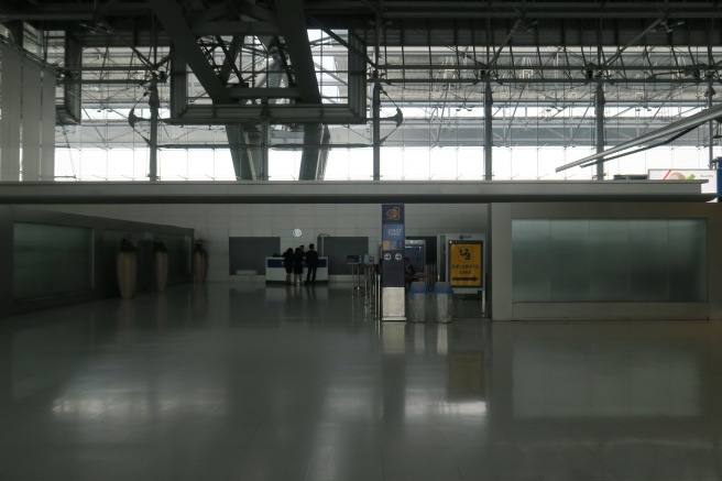 a large hall with people standing in it