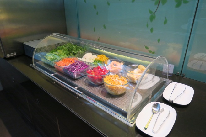 a salad bar with different types of food