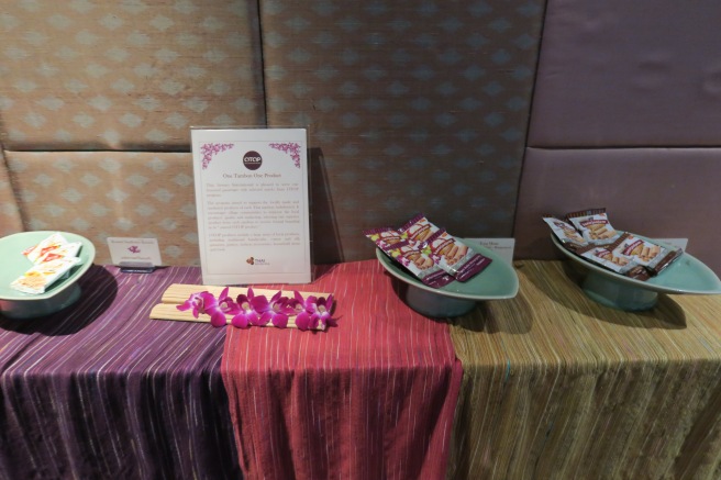 a table with plates of food and a sign