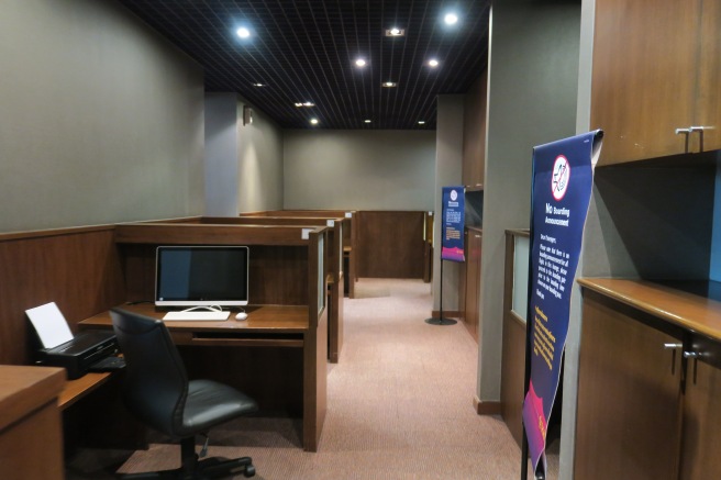 a room with a computer desk and a chair