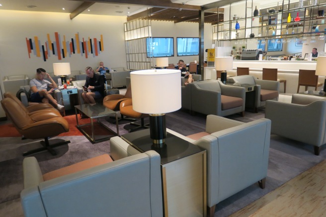 a group of people sitting in a lounge area