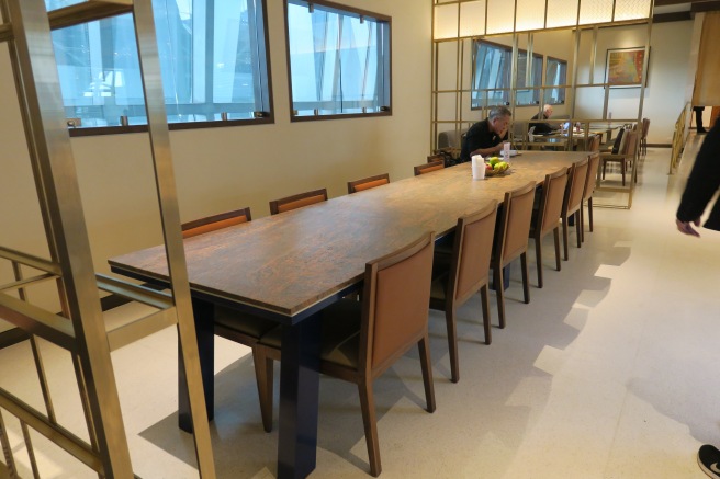 a long table with chairs in a room