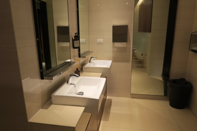 a bathroom with a mirror and sink