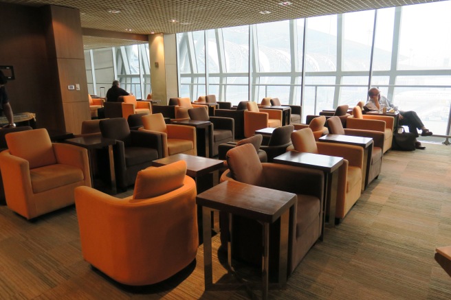 a room with many chairs and tables