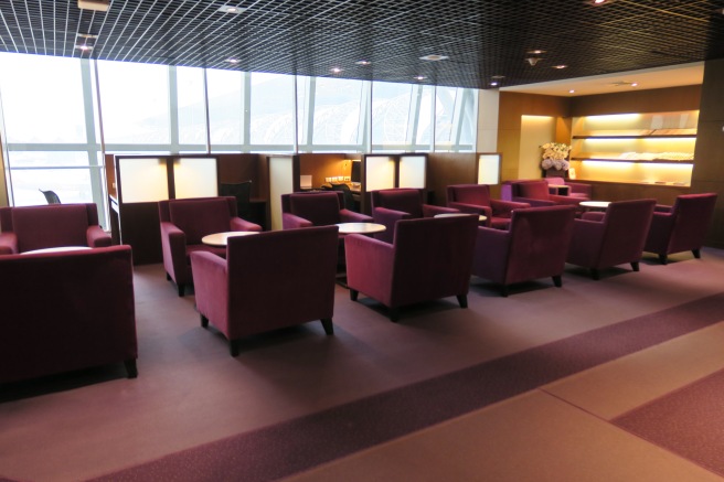 a room with purple chairs and tables