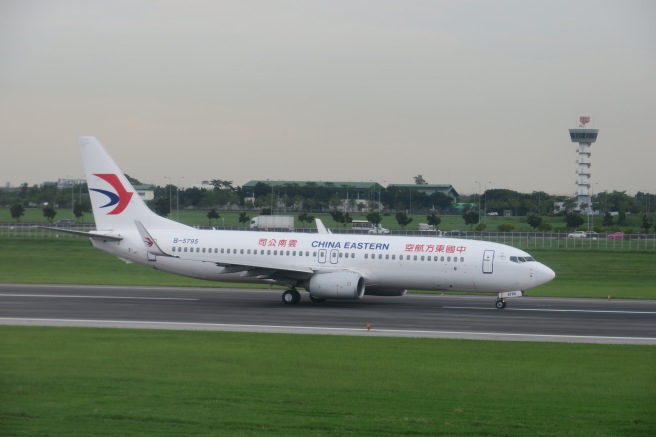 a white airplane on a runway