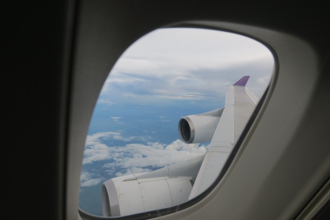 a view of the wing of an airplane from a window