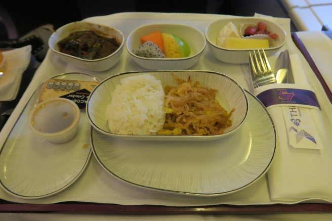 a plate of food on a tray