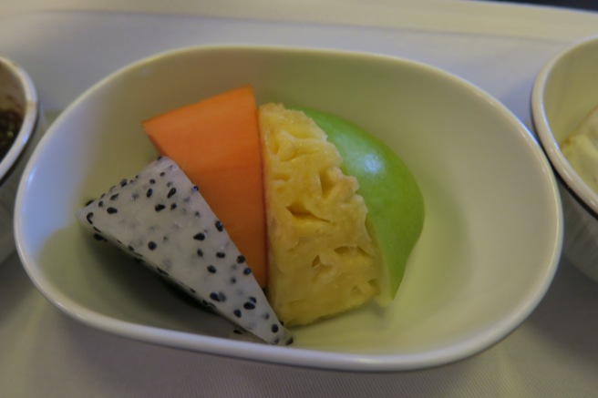 a bowl of fruit on a table