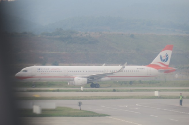 a white airplane on a runway