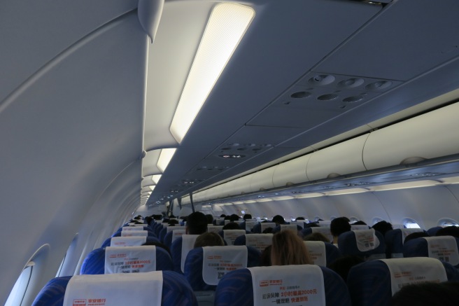 a group of people sitting on an airplane