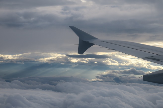 an airplane wing in the sky