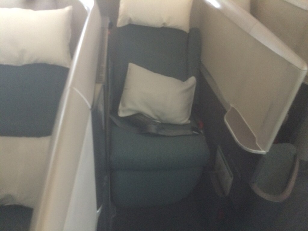 a seat with pillows on it