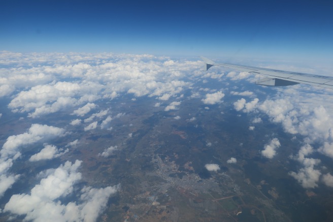 an airplane wing and clouds