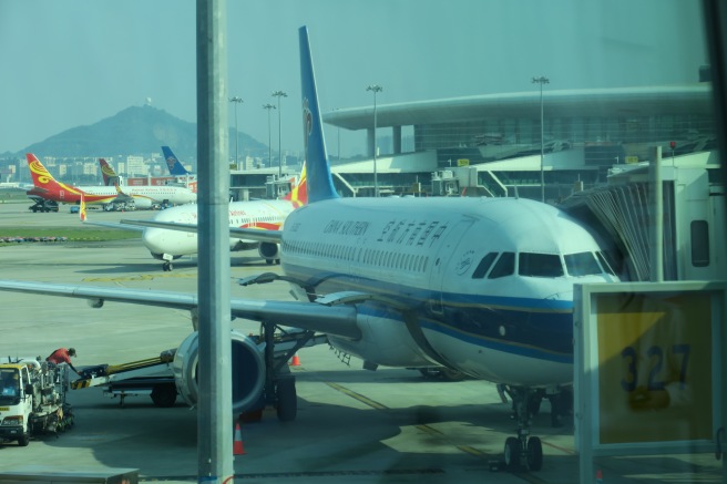 a group of airplanes at an airport