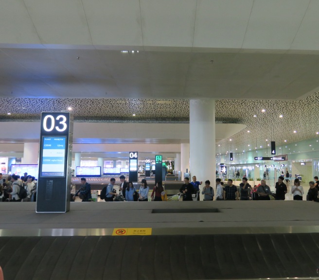 a group of people standing in a terminal