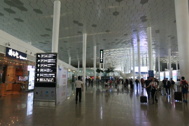 people walking in a large airport