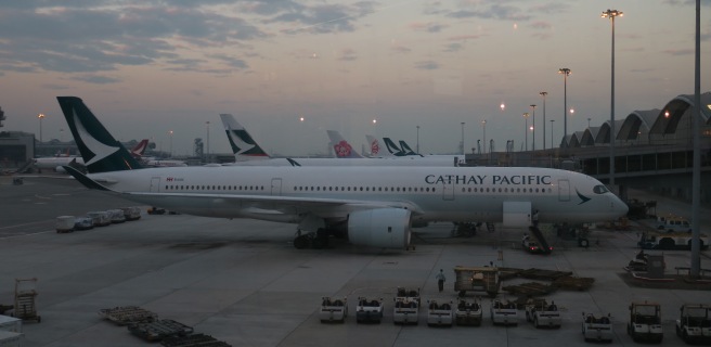 a large white airplane parked at an airport