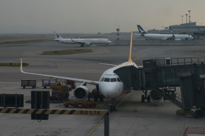 a group of airplanes at an airport