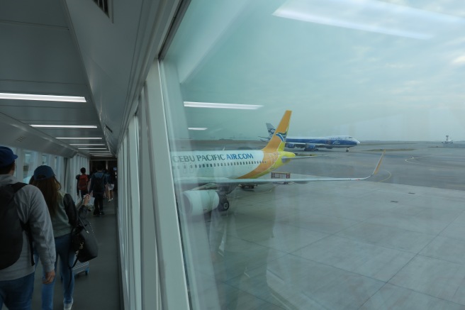 a group of people walking in an airport