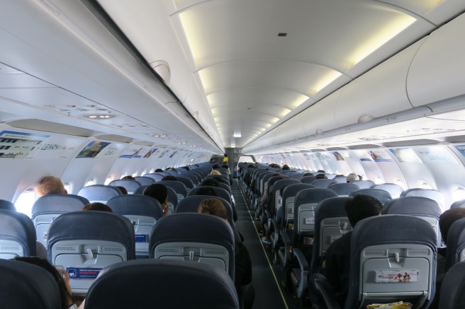 a plane with seats and people in it