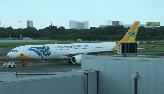 a white airplane on the runway