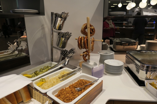 a buffet table with food and utensils